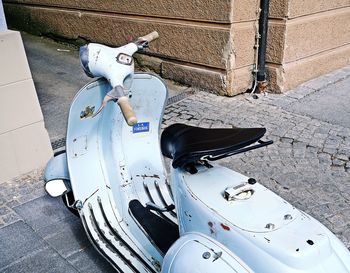 High angle view of motor scooter on footpath