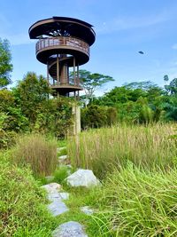 Gazebo on field against sky