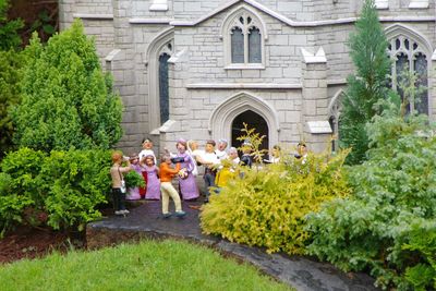 People walking in front of church