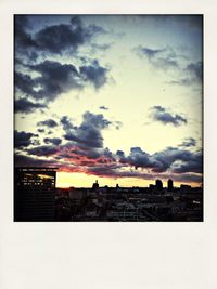 View of city against cloudy sky