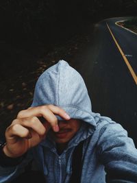 High angle view of man holding umbrella on street