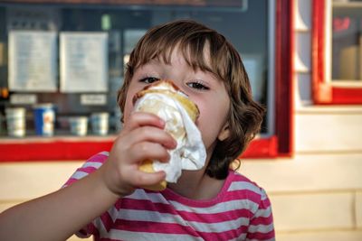 Close-up of child holding ice cream cone