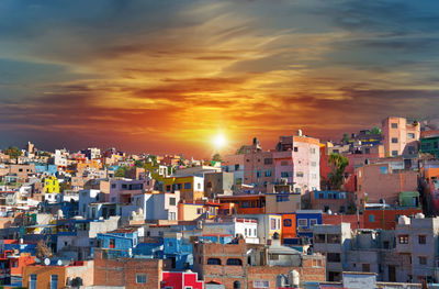 High angle view of townscape against sky during sunset