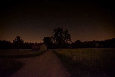 Scenic view of field against sky at night