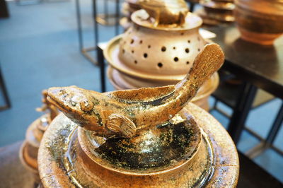 High angle view of old tea cup on table