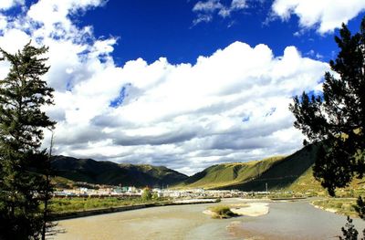 Scenic view of landscape and mountains against sky