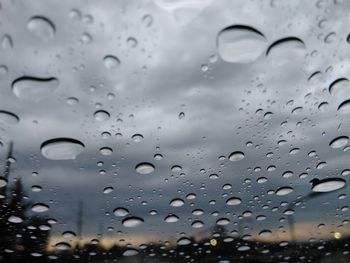 Full frame shot of raindrops on water