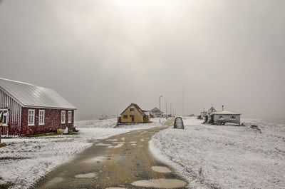 Sun breaking through the clouds while a blizzard tortures the island on a cold day in early spring