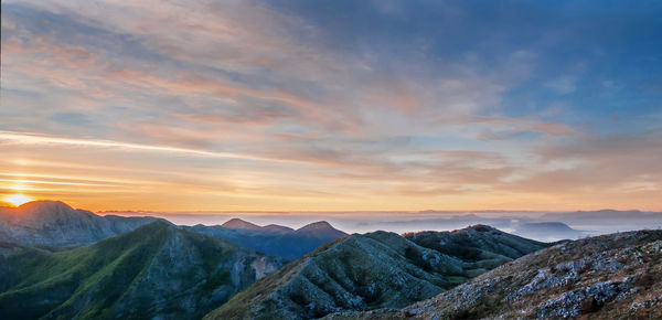 Scenic view of mountains against sky during sunset