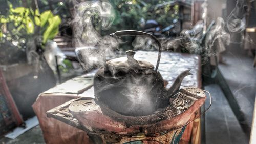 Close-up of metal container on table