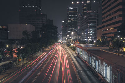 High angle view of light trails on road at night