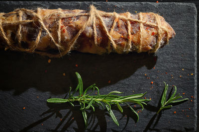 High angle view of meat on barbecue