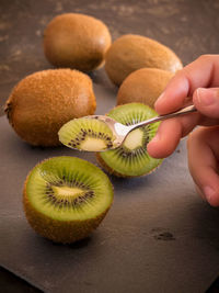 Close-up of hand holding fruits