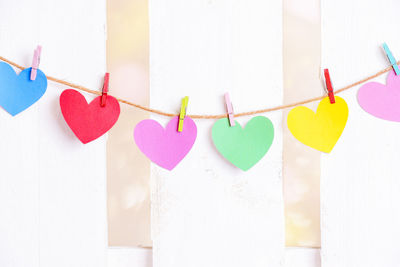 Close-up of multi colored clothespins hanging on clothesline