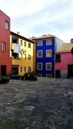 Houses against sky in city