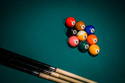 High angle view of multi colored balls against blue background