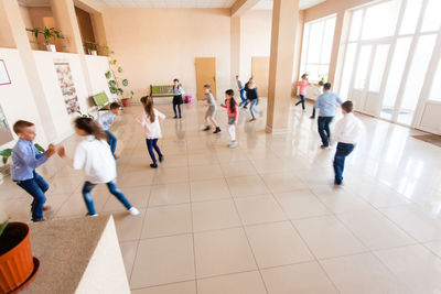 Group of people walking in corridor