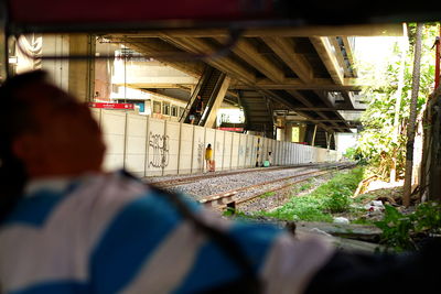 Rear view of man on railroad track