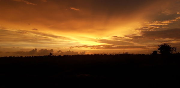 Scenic view of dramatic sky during sunset
