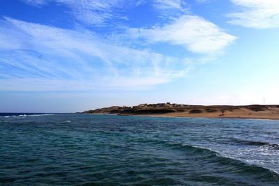 Scenic view of sea against cloudy sky