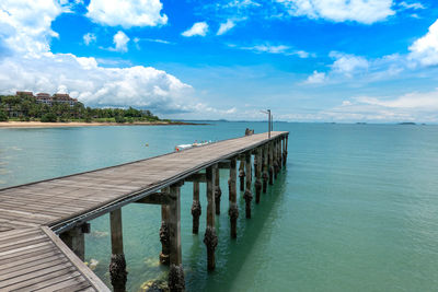 Pier over sea against sky