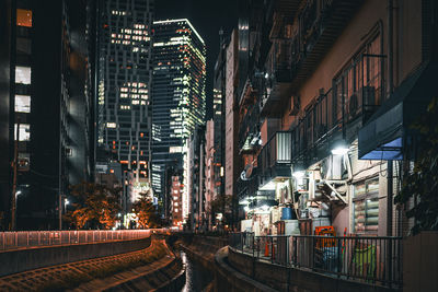 Illuminated buildings in city at night