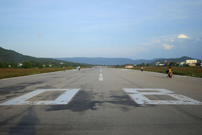 Airport runway against sky