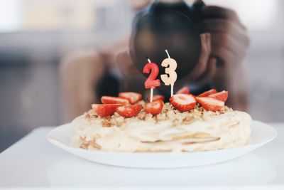 Close-up of birthday cake with candles