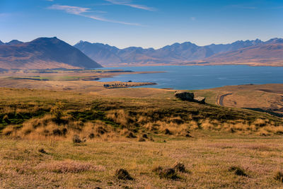 Scenic view of landscape and mountains against sky