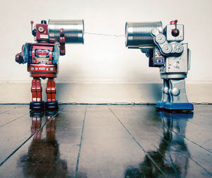 Close-up of camera on floor against wall