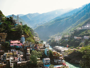 High angle view of townscape and mountains against sky