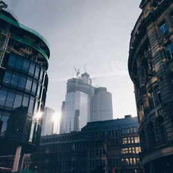 Low angle view of buildings in city against sky