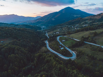 High angle view of road amidst mountains against sky