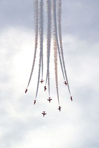 Low angle view of airshow in sky