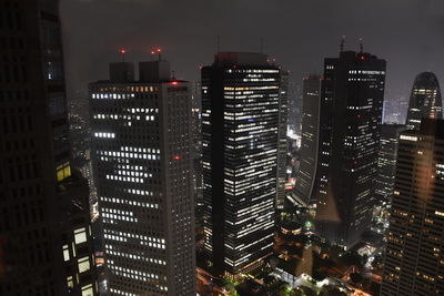 Illuminated buildings in city at night