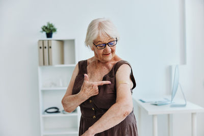 Portrait of smiling woman at home