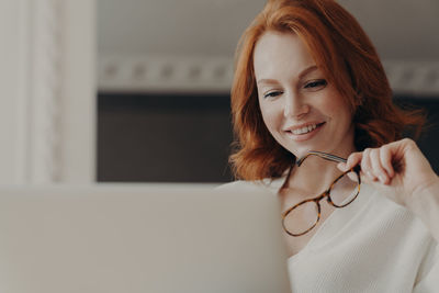 Woman working on laptop at home