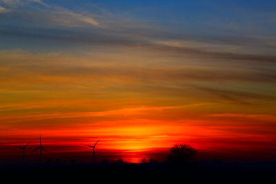 Scenic view of silhouette landscape against sky during sunset