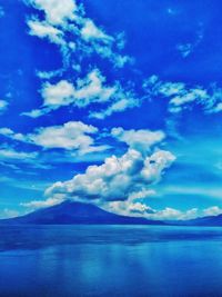 Scenic view of sea against blue sky