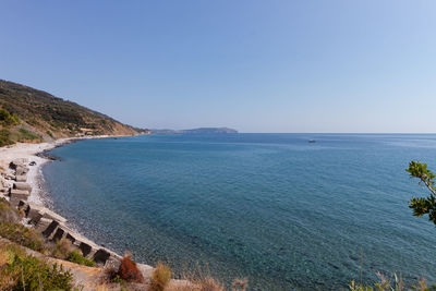 Scenic view of sea against clear blue sky