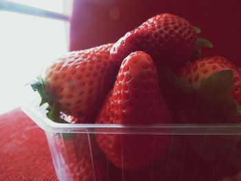 Close-up of strawberry in glass container