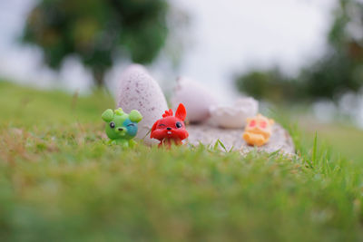 Close-up of stuffed toy on field