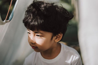 Close-up portrait of boy looking at camera