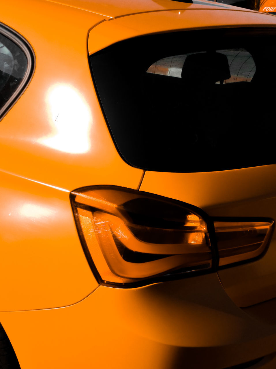 car, mode of transportation, motor vehicle, land vehicle, transportation, close-up, orange color, no people, reflection, glass - material, outdoors, sunset, yellow, headlight, travel, side-view mirror, stationary, transparent, vehicle interior, luxury