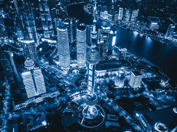 High angle view of illuminated buildings in city at night