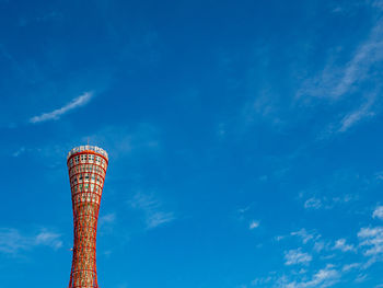 Low angle view of smoke stack against sky