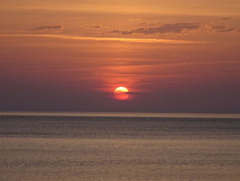 Scenic view of sea against sky at sunset