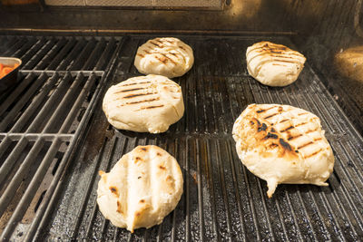 High angle view of meat on barbecue grill