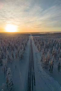 Straight road on a winter sunset