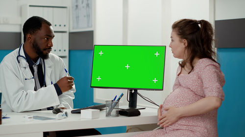 Doctor examining patient at clinic